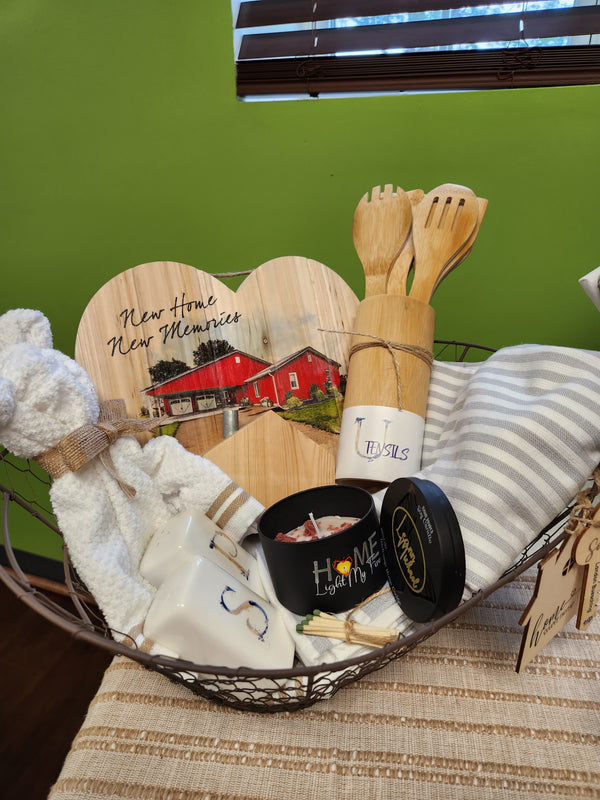New home gift basket with candle, utensils, salt pepper shakers, hand towel, teddy bear towel, and new home new memories personalized home wood heart